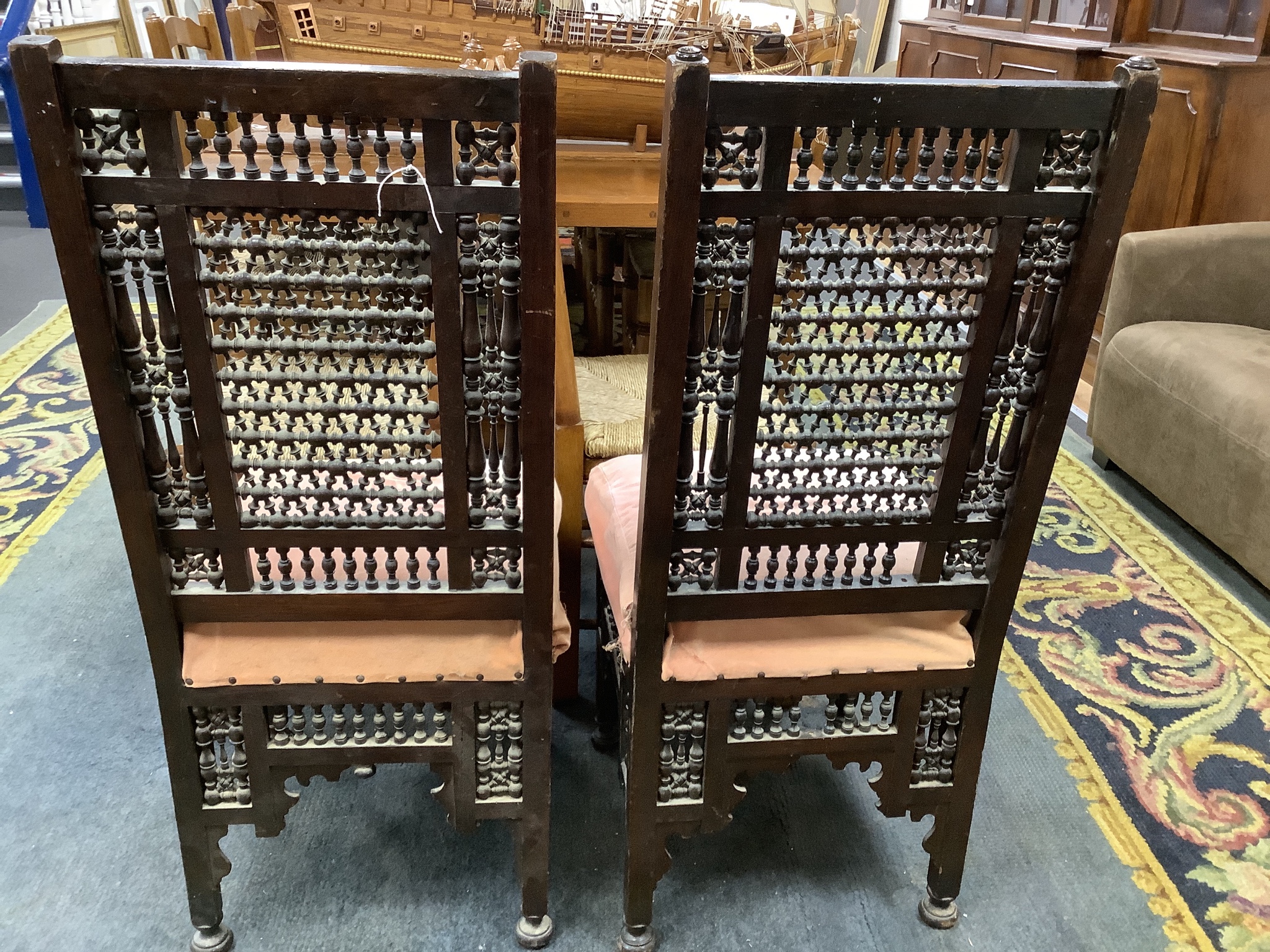 A pair of Liberty-style Moorish hardwood side chairs.